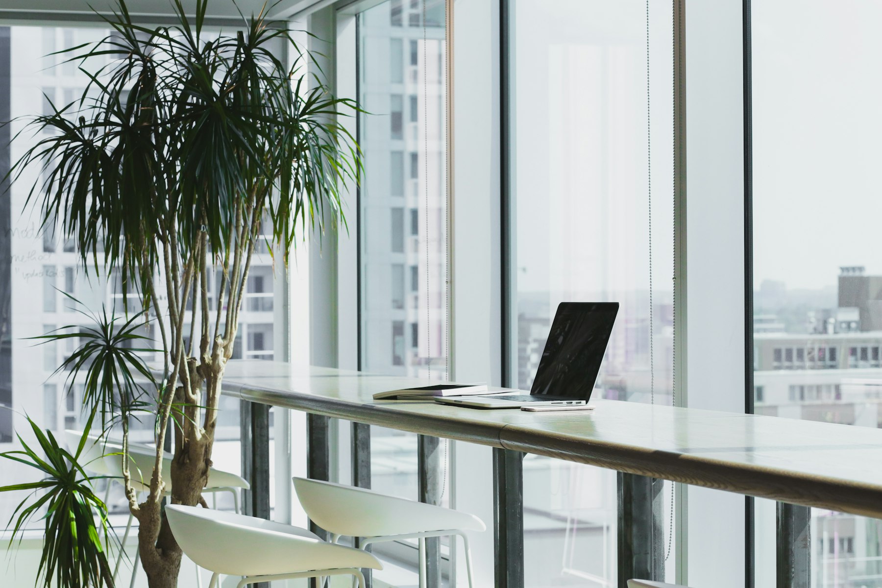 A real photograph of renewed communication workspace with durable controls and clear routing
